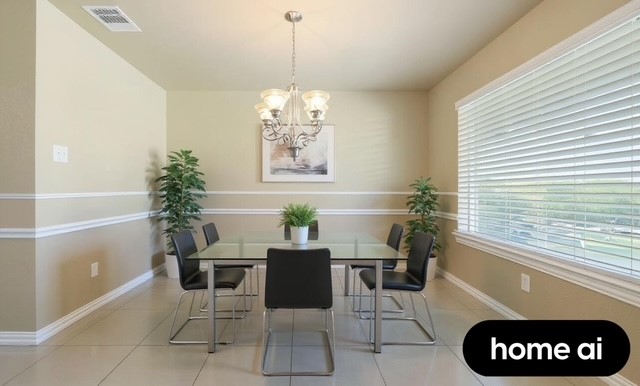 2715 Toyah Avenue Houston, TX 77039 - Photo 4 of 18 Bright and inviting dining area with modern lighting, large windows for natural light, and elegant decor. Perfect for family gatherings and entertaining guests.