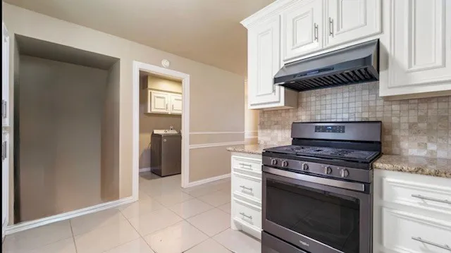 a kitchen with a stove and a cabinet
