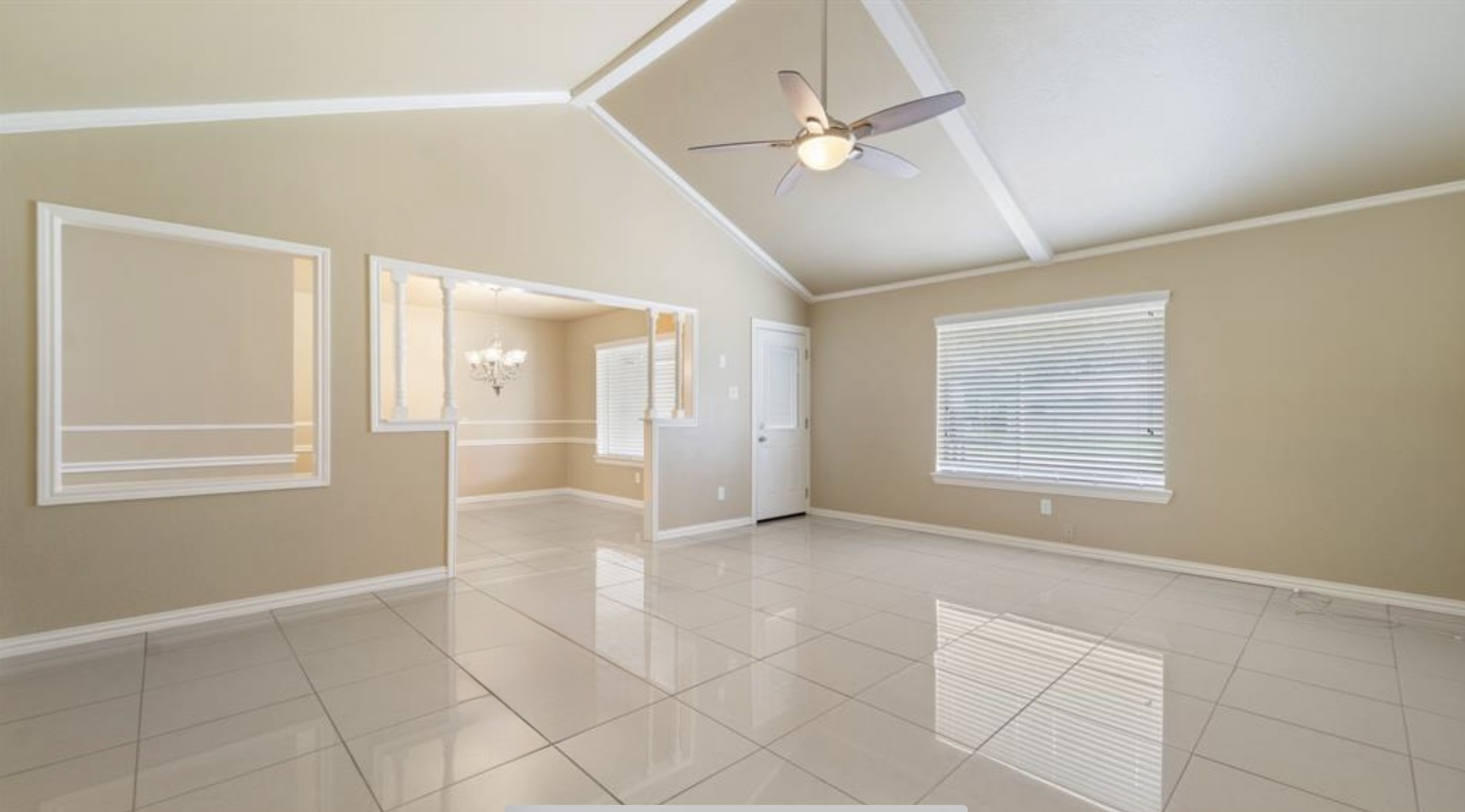 2715 Toyah Avenue Houston, TX 77039 - Photo 8 of 18 Experience the elegance of this spacious living area, featuring high ceilings, gleaming tile floors, and abundant natural light. The open layout flows seamlessly into a charming dining nook, perfect for entertaining.