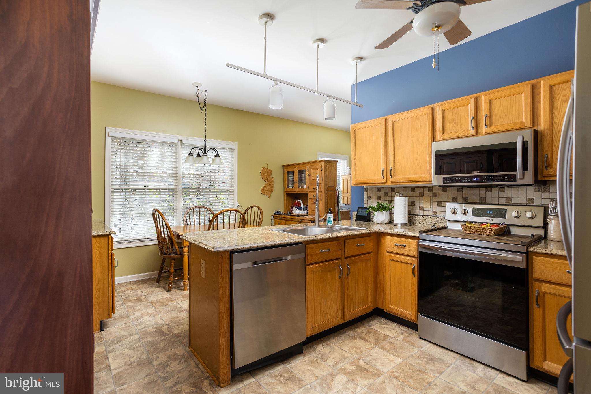 4 Lantern Lane Columbus, NJ 08022 - Photo 17 of 46 a kitchen with a sink appliances and cabinets