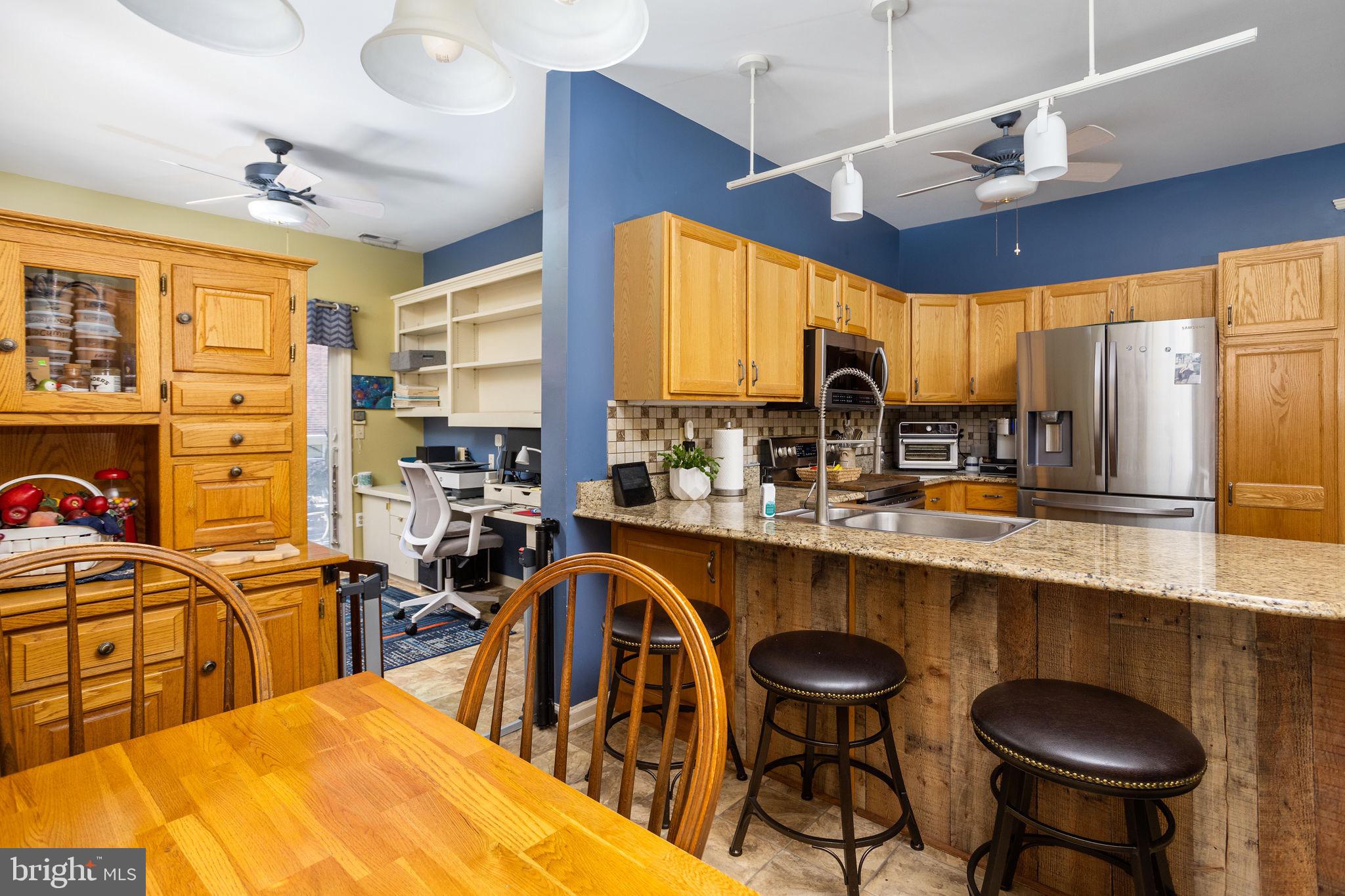 4 Lantern Lane Columbus, NJ 08022 - Photo 20 of 46 a large kitchen with lots of counter space a sink and chairs