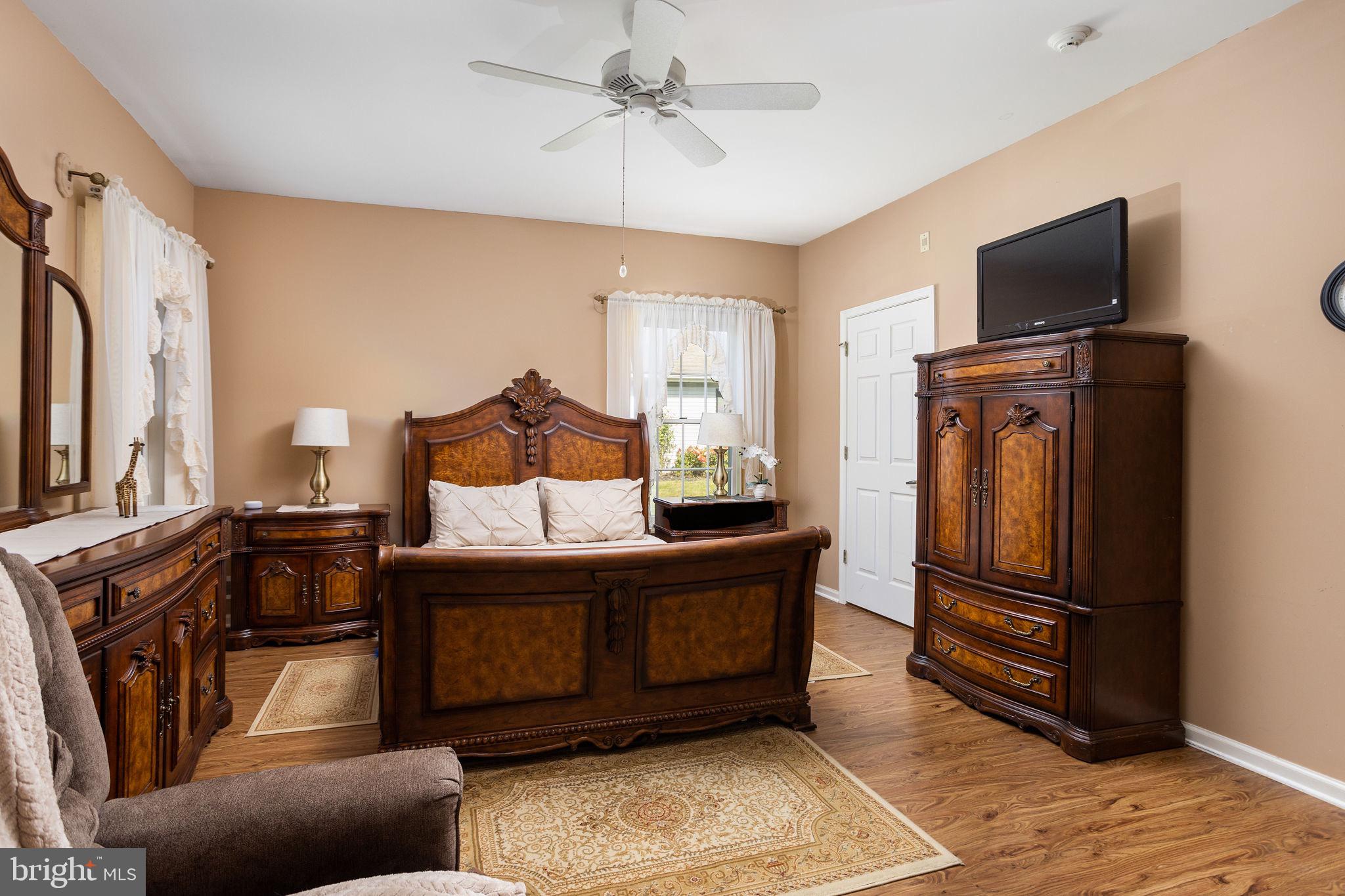 4 Lantern Lane Columbus, NJ 08022 - Photo 29 of 46 a bedroom with furniture and a flat screen tv
