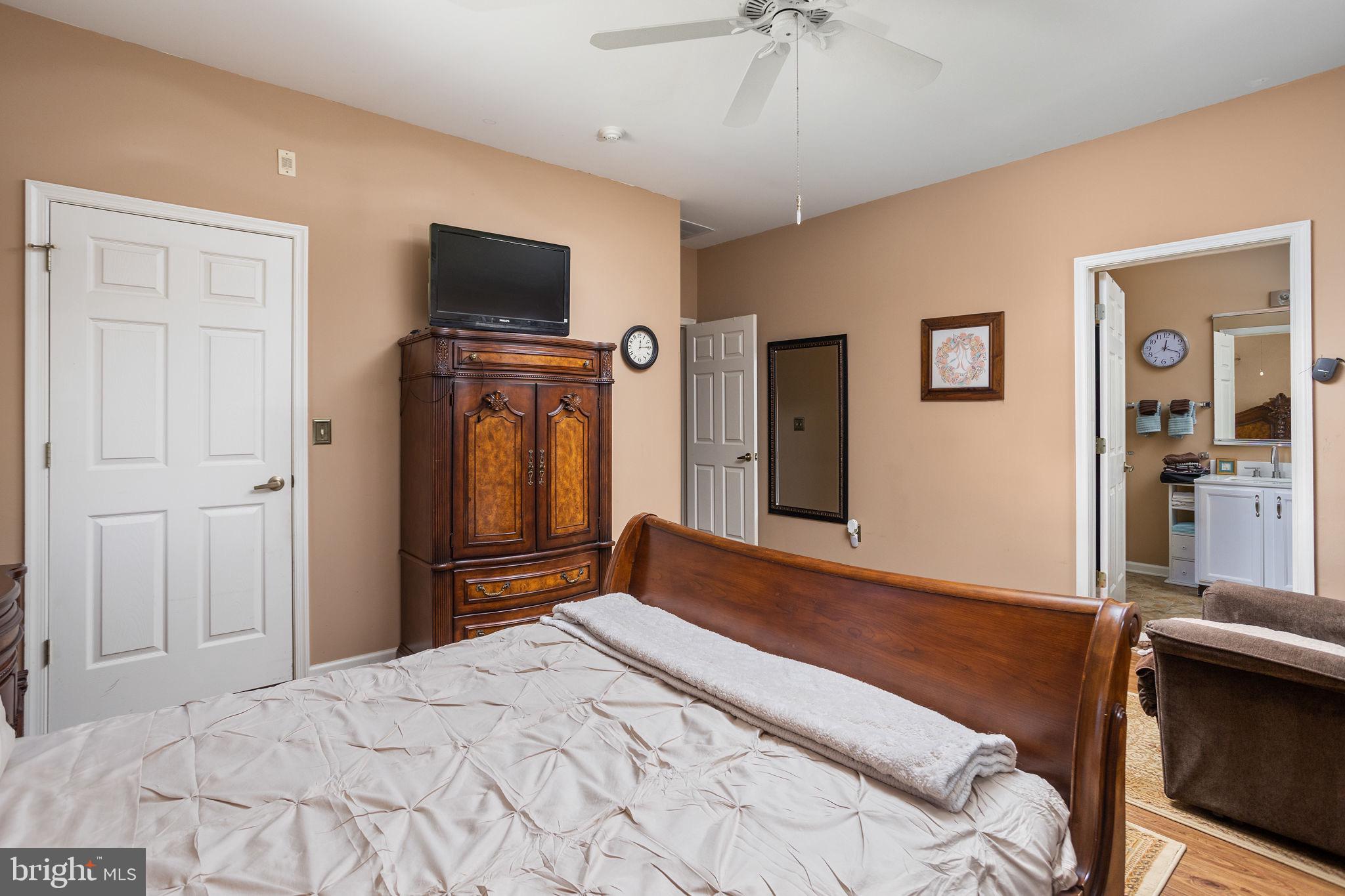 4 Lantern Lane Columbus, NJ 08022 - Photo 30 of 46 a bedroom with a bed and a flat screen tv