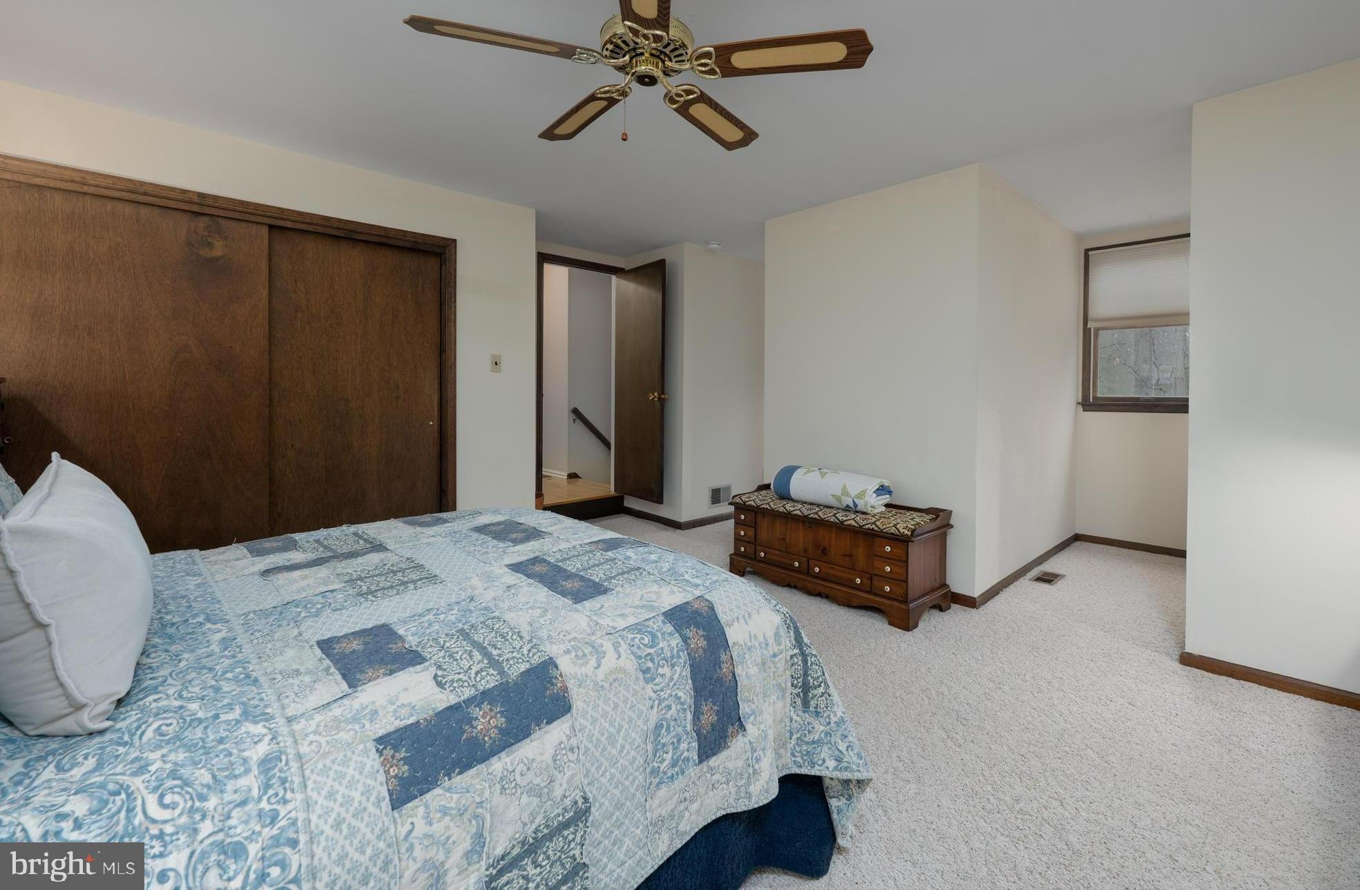 1 Strafford Circle Road Medford, NJ 08055 - Photo 21 of 31 a bedroom with a bed and a chandelier