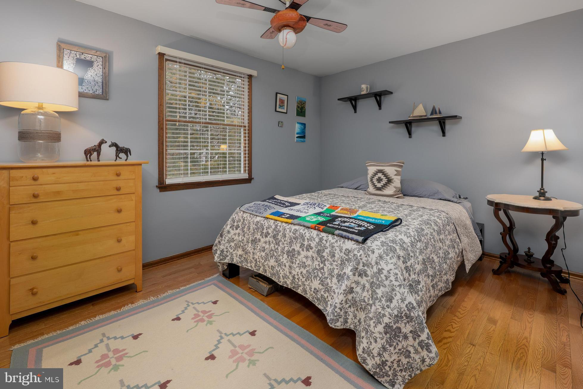 1 Strafford Circle Road Medford, NJ 08055 - Photo 22 of 31 a bedroom with a bed and a lamp on dresser