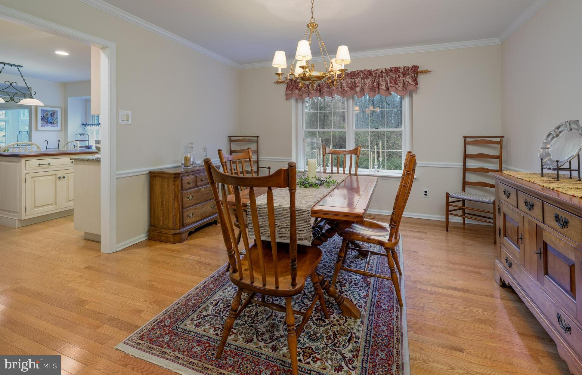 1 Strafford Circle Road Medford, NJ 08055 - Photo 7 of 31 a dining room with furniture a chandelier and wooden floor