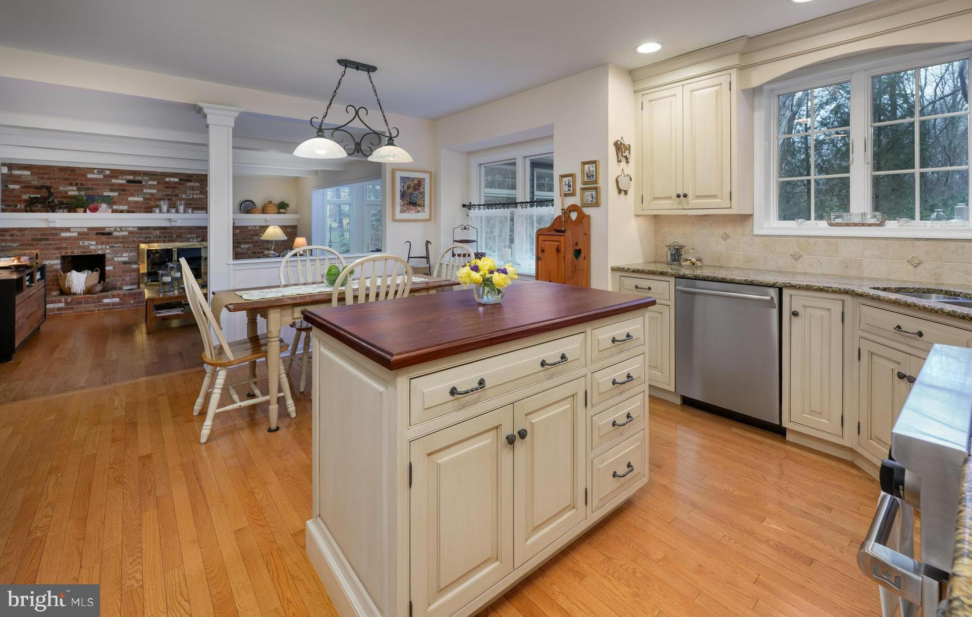 1 Strafford Circle Road Medford, NJ 08055 - Photo 8 of 31 a kitchen with stainless steel appliances a stove a sink dishwasher and a dining table with wooden floor