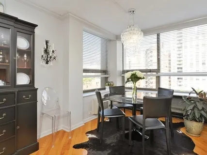 a view of a dining room with furniture and window