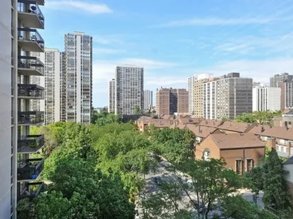 a view of a city with tall buildings in the background