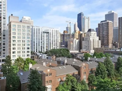 a view of a city with tall buildings