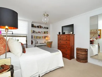 a bedroom with a bed and furniture