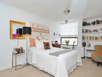 a view of walk in closet with wooden floor