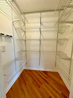 a kitchen with appliances a sink and a window