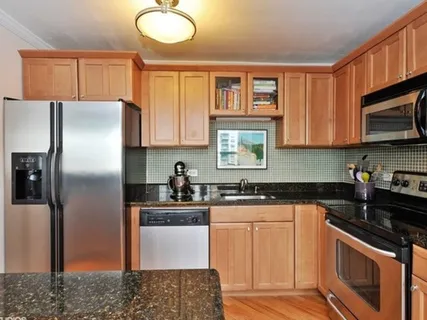 a kitchen with a sink stove and refrigerator
