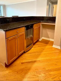 a view of a kitchen with wooden floor