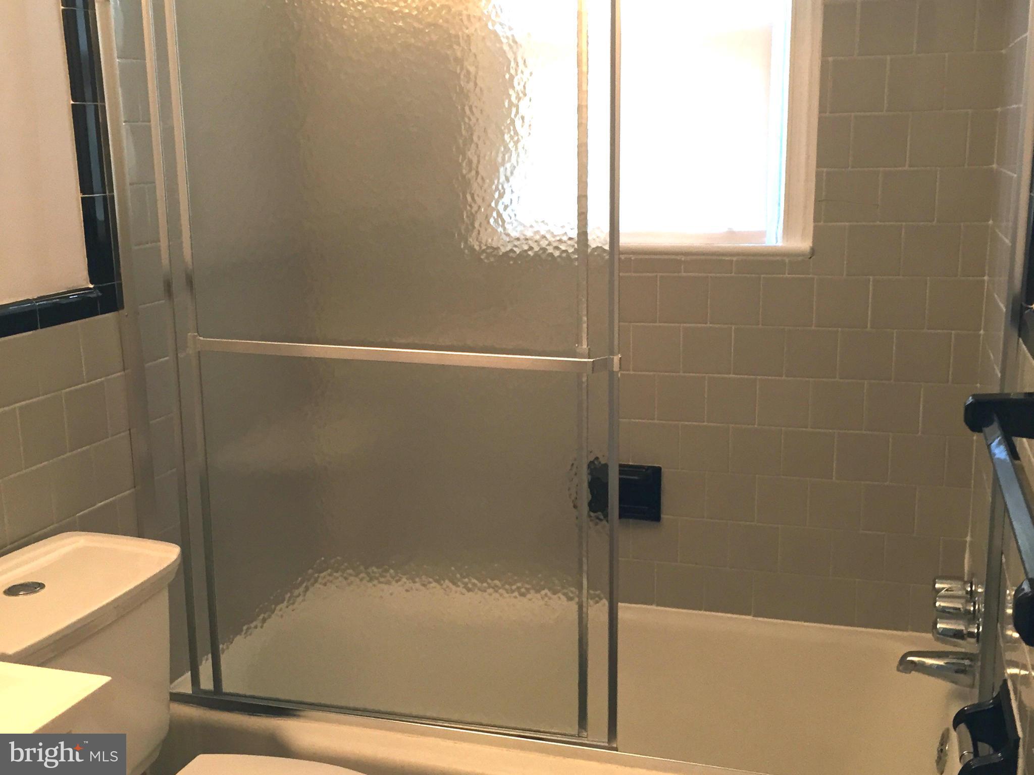9911 Old Fort Road Fort Washington, MD 20744 - Photo 11 of 25 a bathroom with a bathtub