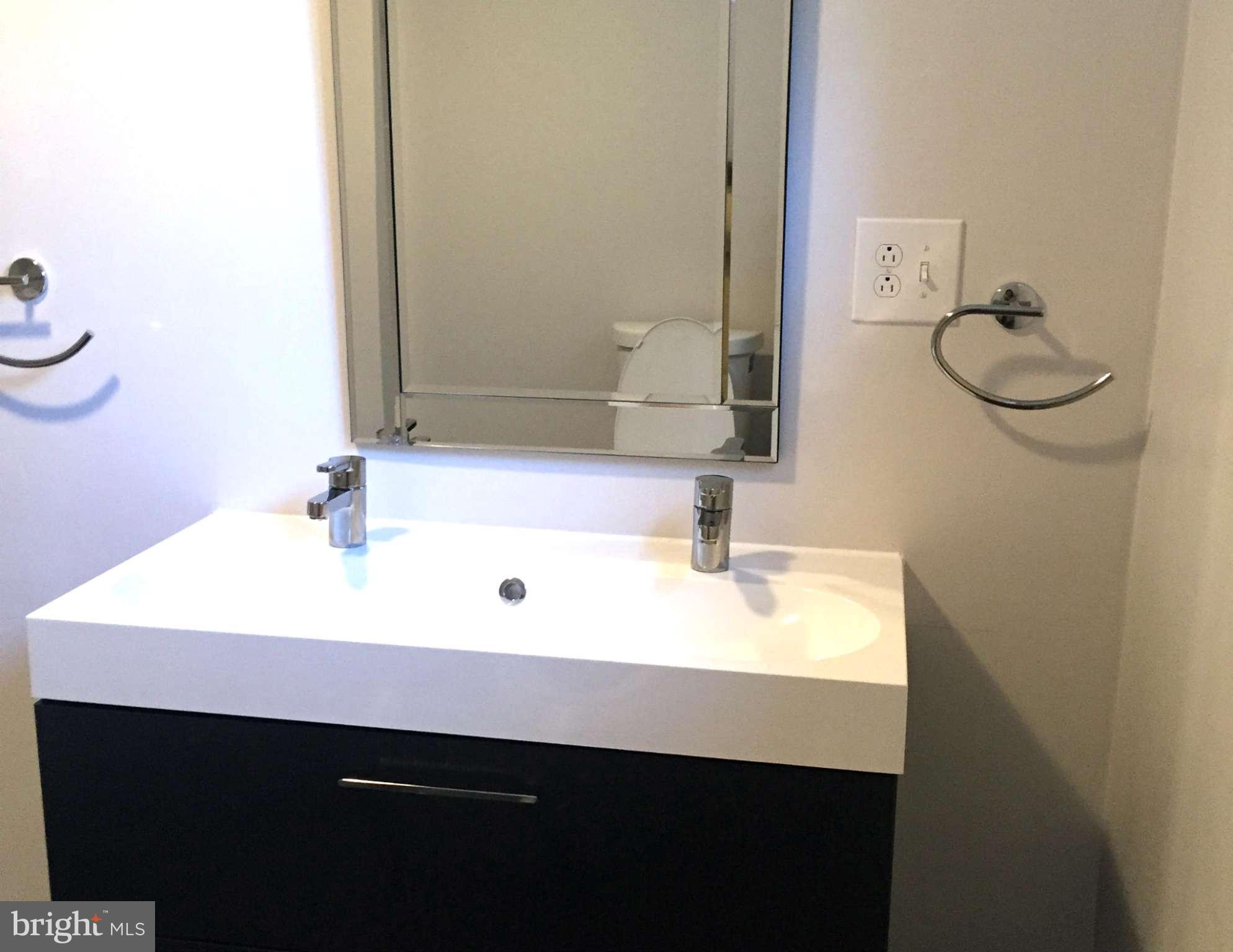 9911 Old Fort Road Fort Washington, MD 20744 - Photo 17 of 25 a bathroom with a sink and a mirror