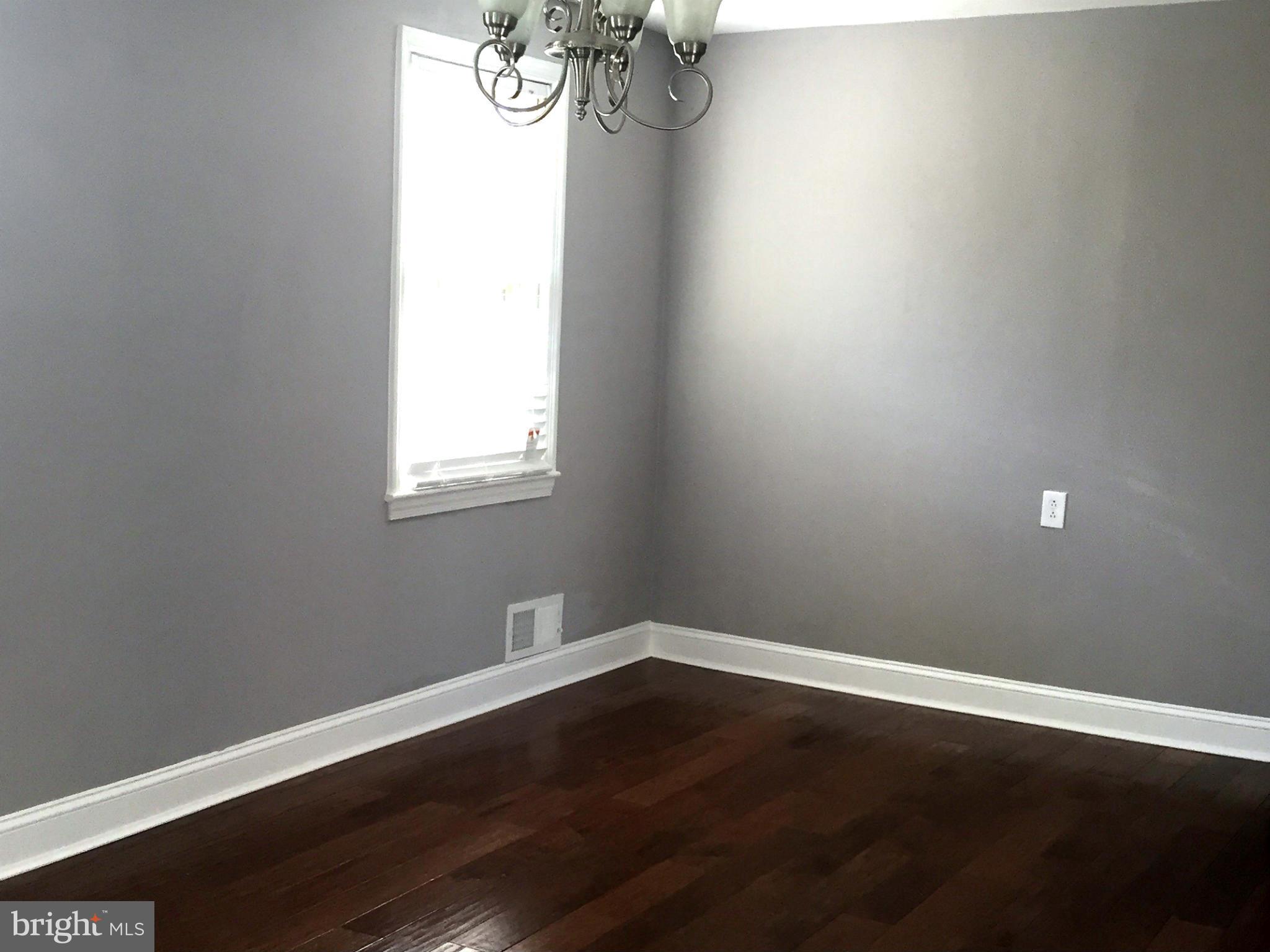 9911 Old Fort Road Fort Washington, MD 20744 - Photo 4 of 25 a view of a small space with wooden floor and a window