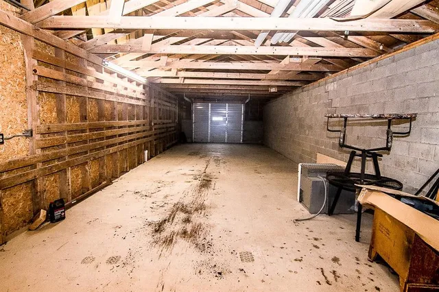 a view of a storage room with a table and chairs