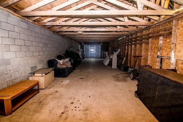 a view of a big yard with swimming pool and green space