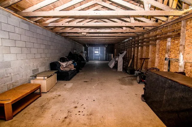 a view of a big yard with swimming pool and green space