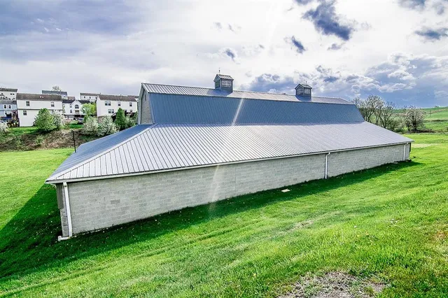 a view of a backyard with wooden fence