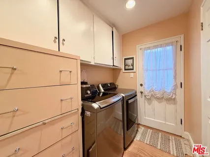 a bathroom with a toilet a sink and a mirror
