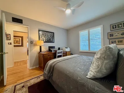 a backyard of a house with fire pit and outdoor seating