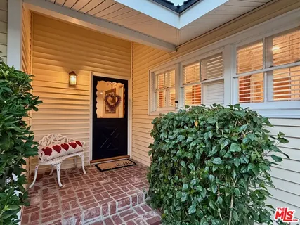 a front view of a house with a large window