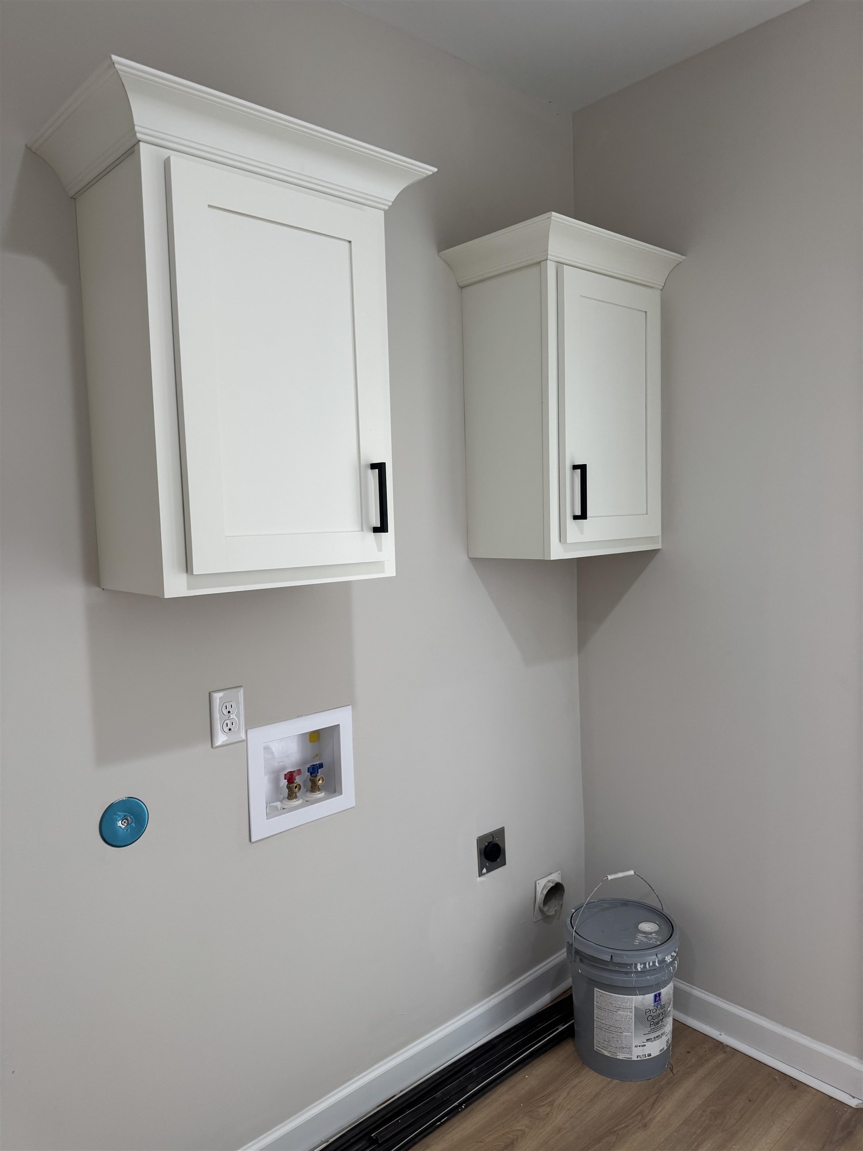 5549 Shipp Road Millington, TN 38053 - Photo 23 of 37 Washer and dryer hookup, cabinet space, wood finished floors, and baseboards