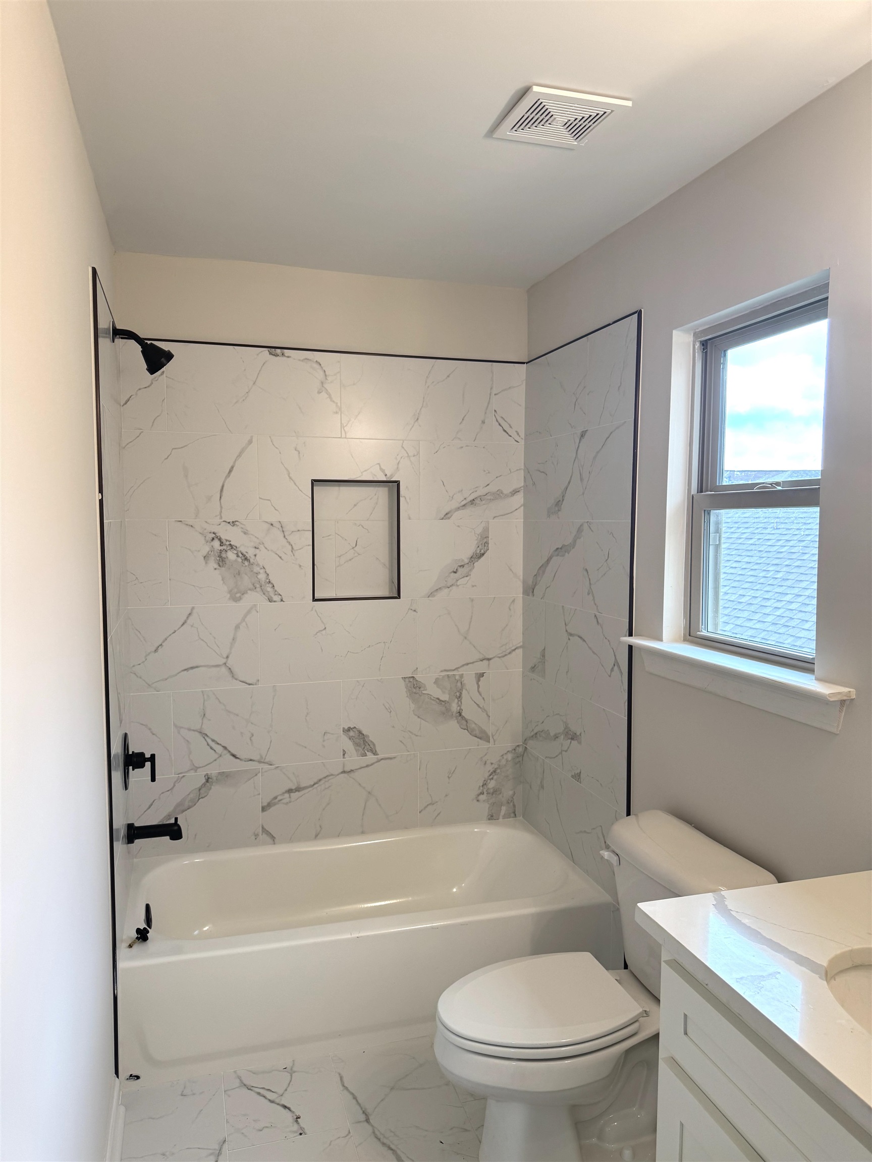 5549 Shipp Road Millington, TN 38053 - Photo 27 of 37 Bathroom with vanity, shower, toilet, and marble look tiles