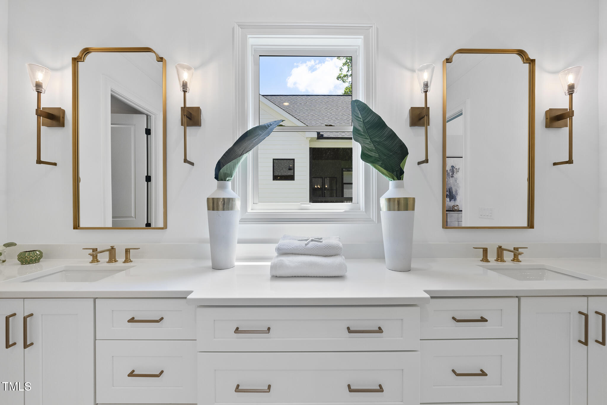 5307 Dixon Drive Raleigh, NC 27609 - Photo 16 of 48 a bathroom with vanity mirror and a sink