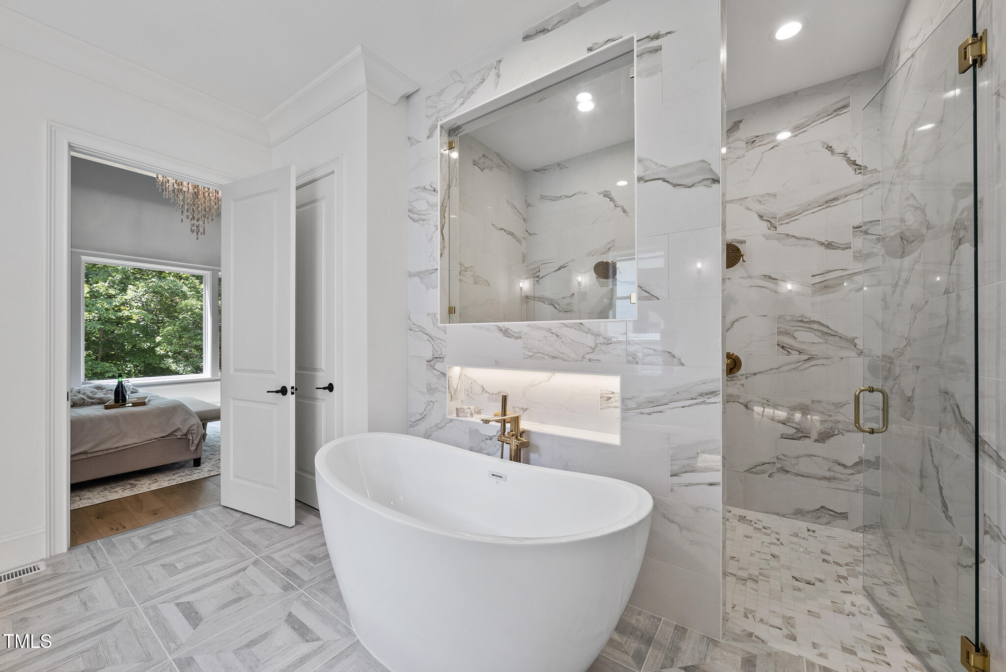 5307 Dixon Drive Raleigh, NC 27609 - Photo 17 of 48 a spacious bathroom with a bathtub and shower