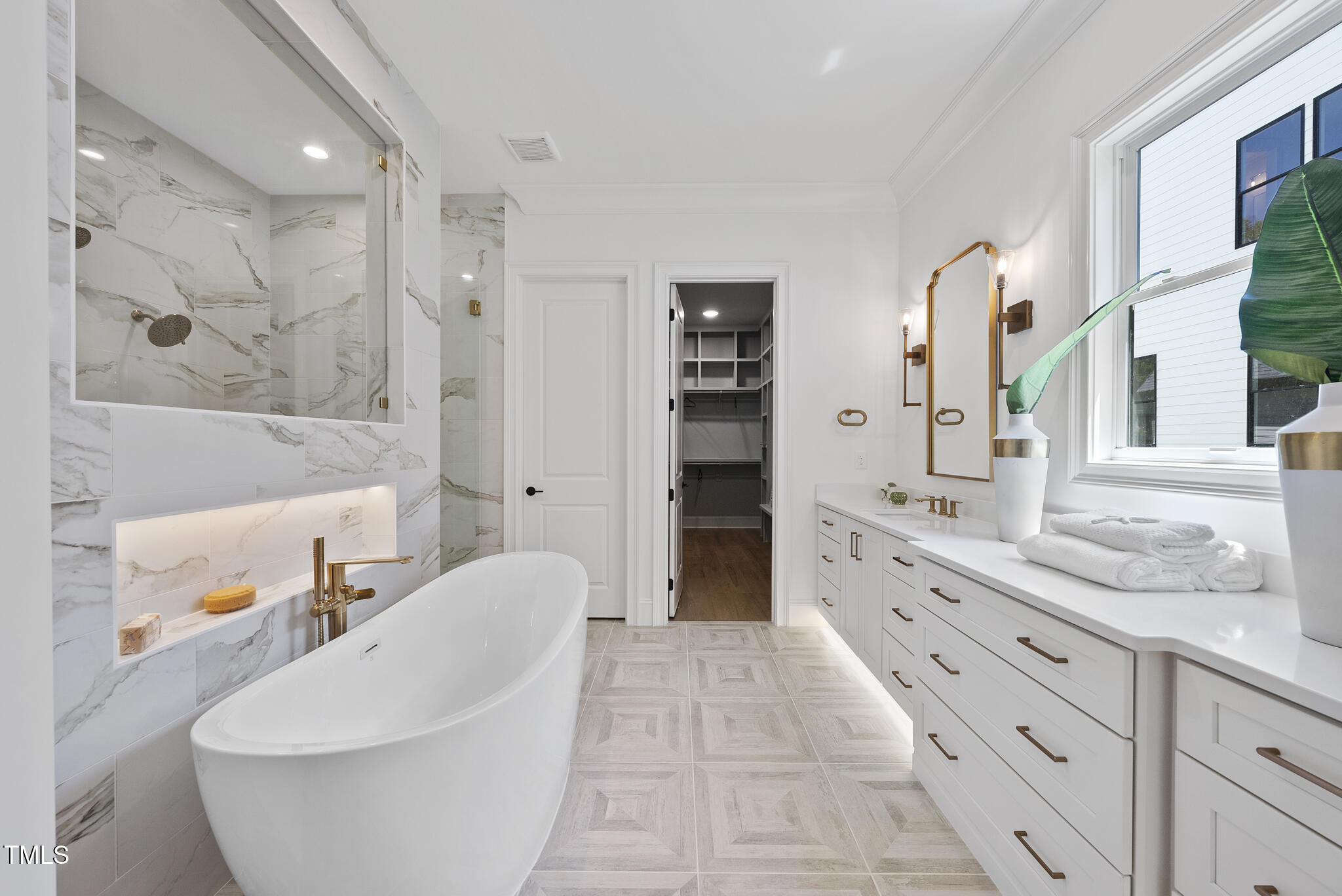 5307 Dixon Drive Raleigh, NC 27609 - Photo 18 of 48 a spacious bathroom with a granite countertop sink and a mirror
