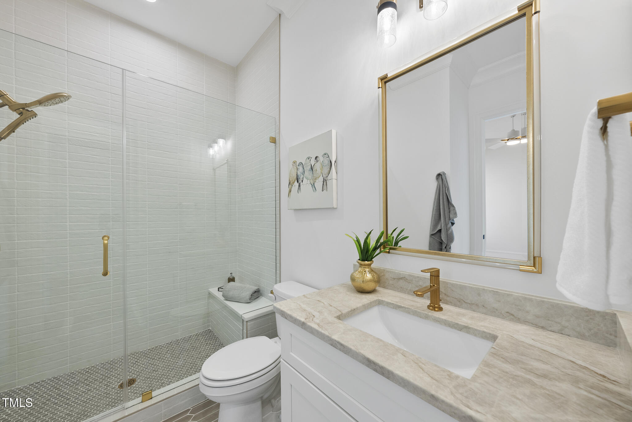 5307 Dixon Drive Raleigh, NC 27609 - Photo 22 of 48 a bathroom with a granite countertop sink a toilet and a mirror