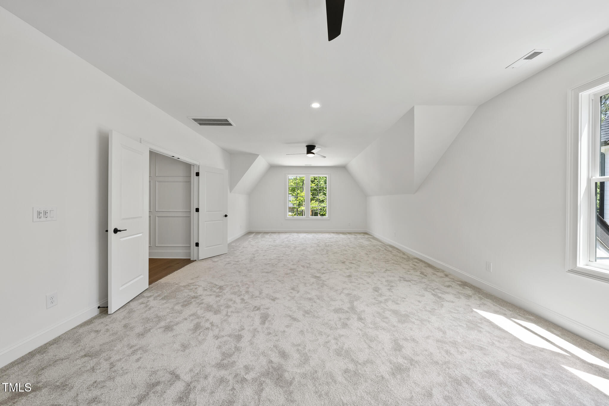 5307 Dixon Drive Raleigh, NC 27609 - Photo 23 of 48 wooden floor in an empty room with a window