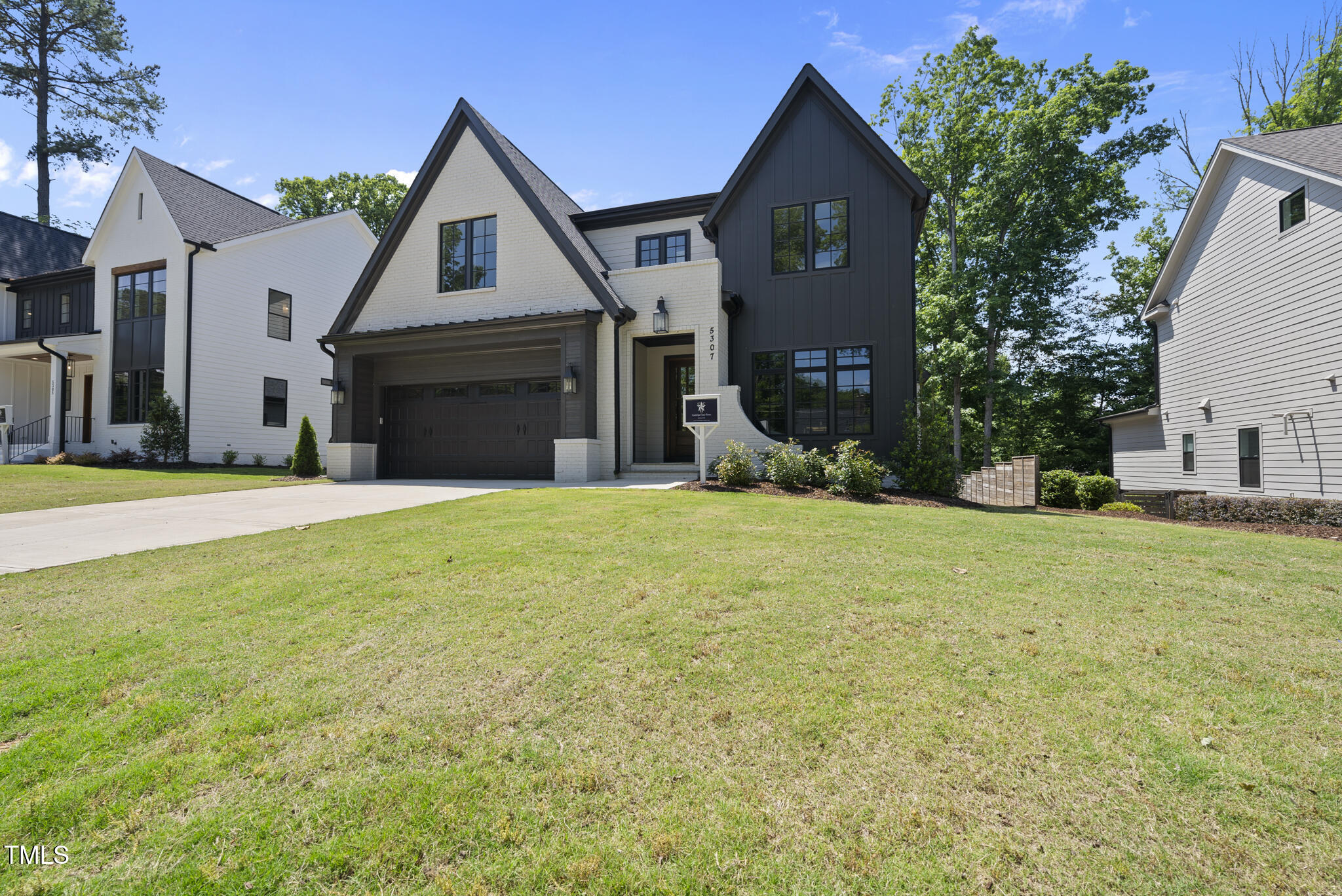 5307 Dixon Drive Raleigh, NC 27609 - Photo 3 of 48 a front view of a house with a yard