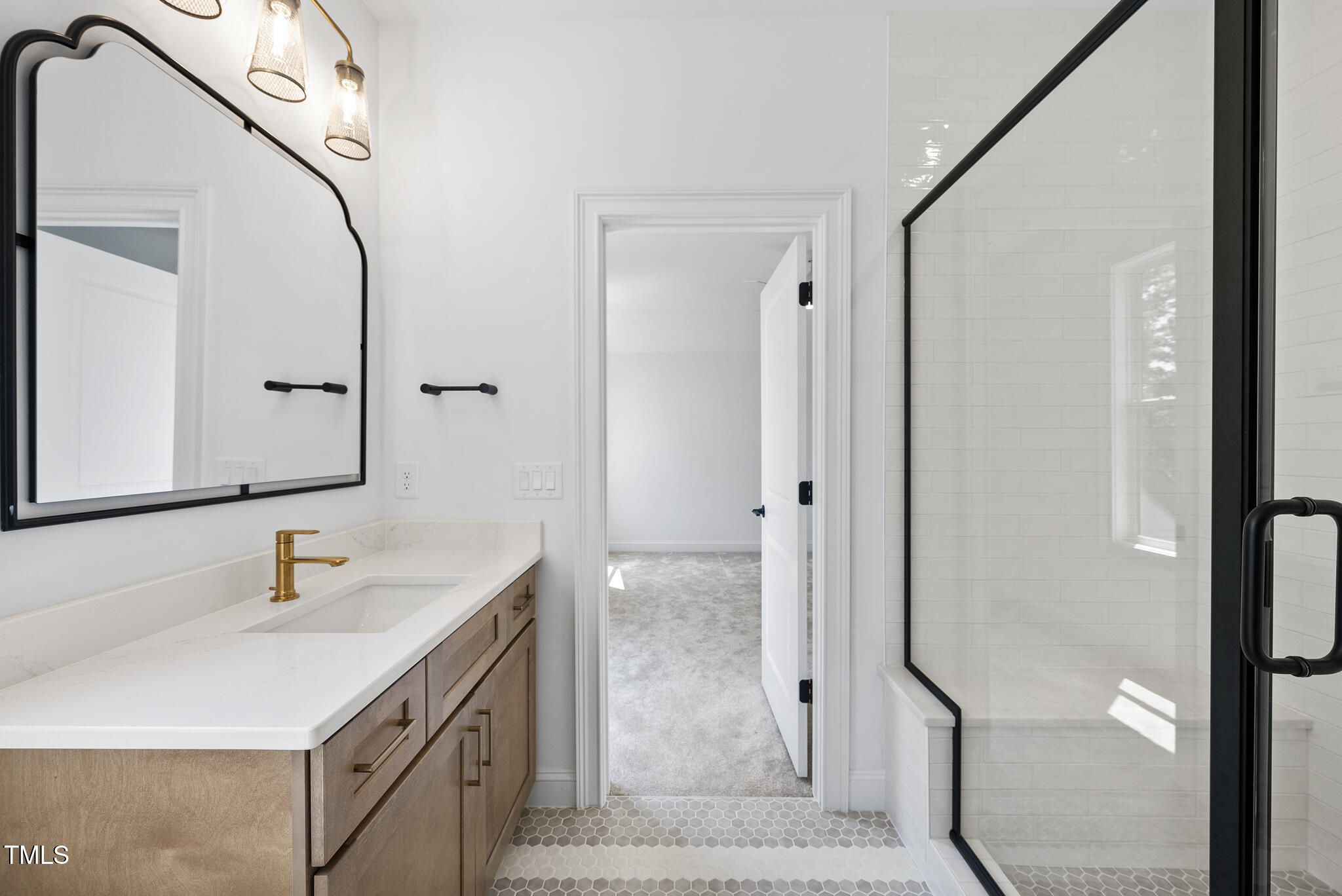 5307 Dixon Drive Raleigh, NC 27609 - Photo 31 of 48 a bathroom with a sink vanity granite and a mirror