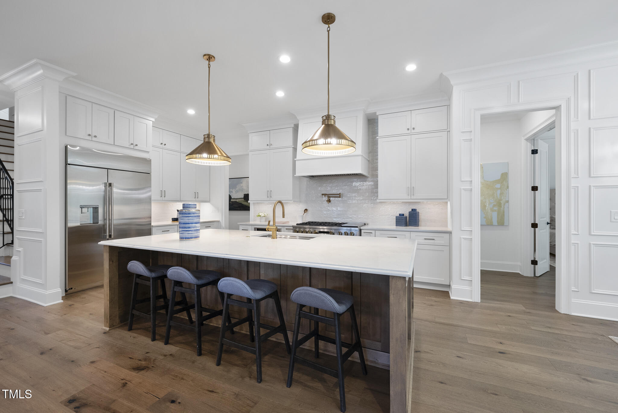 5307 Dixon Drive Raleigh, NC 27609 - Photo 4 of 48 a large kitchen with a table and chairs