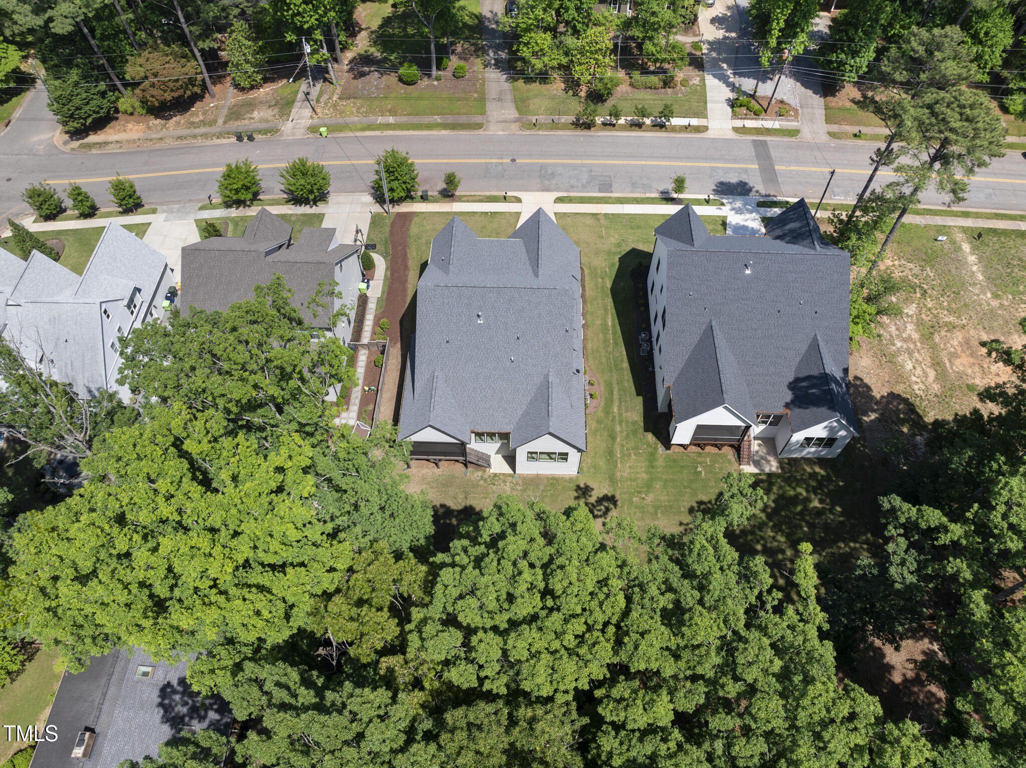 5307 Dixon Drive Raleigh, NC 27609 - Photo 45 of 48 an aerial view of a house with a yard and lake view