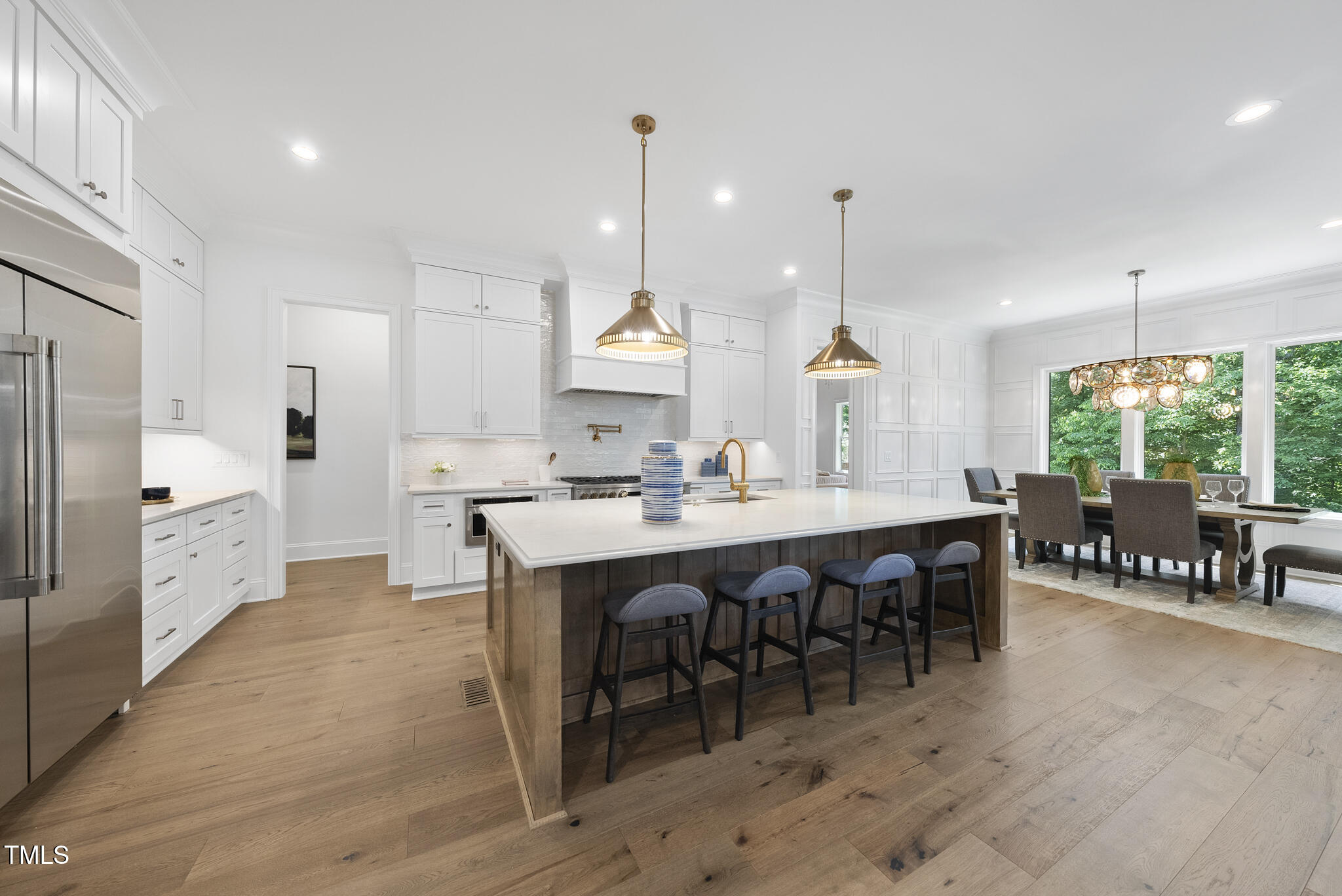 5307 Dixon Drive Raleigh, NC 27609 - Photo 8 of 48 a large kitchen with a table and chairs