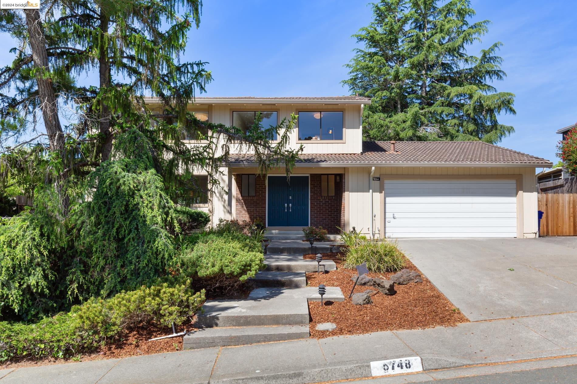 5748 Amend Road El Sobrante, CA 94803 - Photo 1 of 1 front view of a house with potted plants