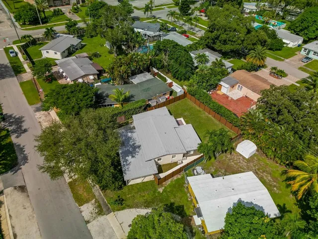 an aerial view of residential houses with outdoor space