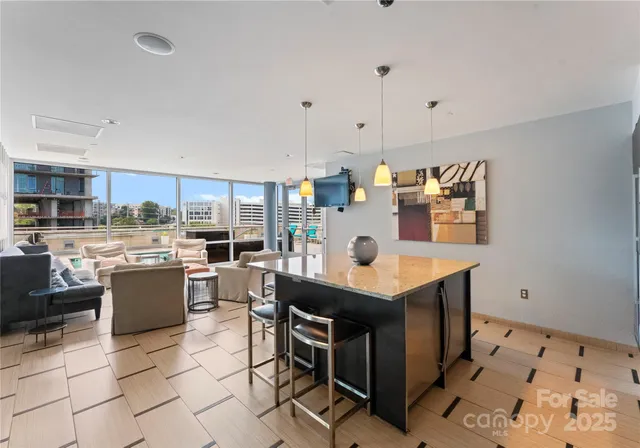 a kitchen with a table and chairs in it
