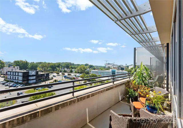 a view of a balcony with chairs