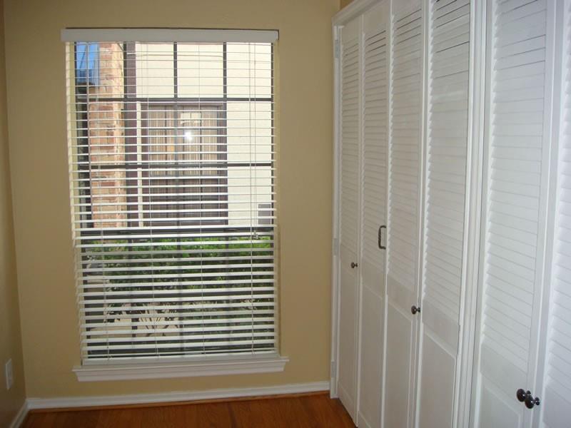 4000 Rawlins Street, Unit 105 Dallas, TX 75219 - Photo 15 of 26 a view of a room that has a window in it