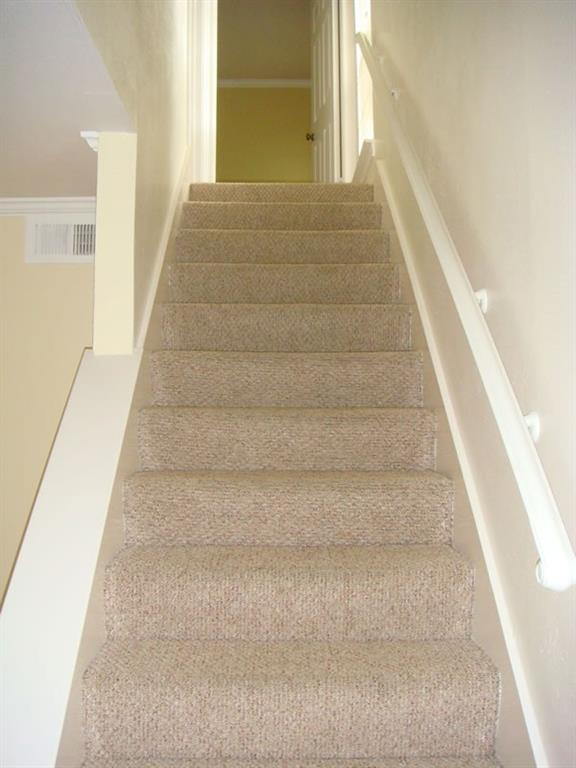 4000 Rawlins Street, Unit 105 Dallas, TX 75219 - Photo 17 of 26 a view of staircase with white walls