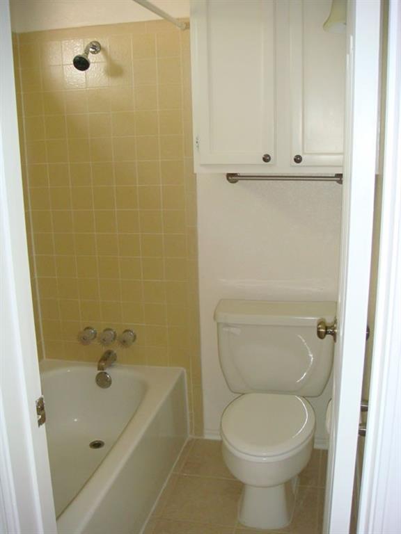 4000 Rawlins Street, Unit 105 Dallas, TX 75219 - Photo 24 of 26 a bathroom with a sink a toilet and shower