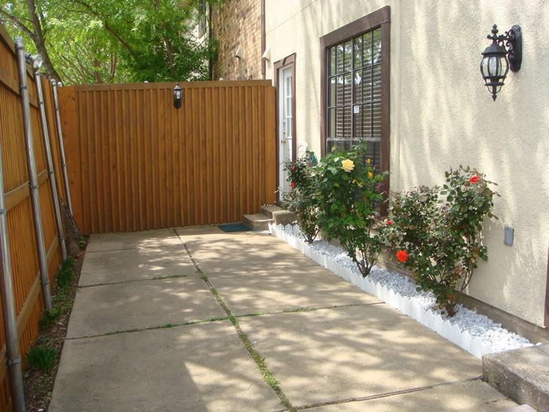 4000 Rawlins Street, Unit 105 Dallas, TX 75219 - Photo 25 of 26 a view of a house with a backyard