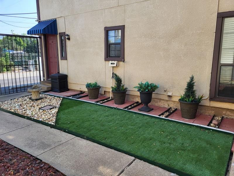 4000 Rawlins Street, Unit 105 Dallas, TX 75219 - Photo 5 of 26 a view of an house with backyard space and garden
